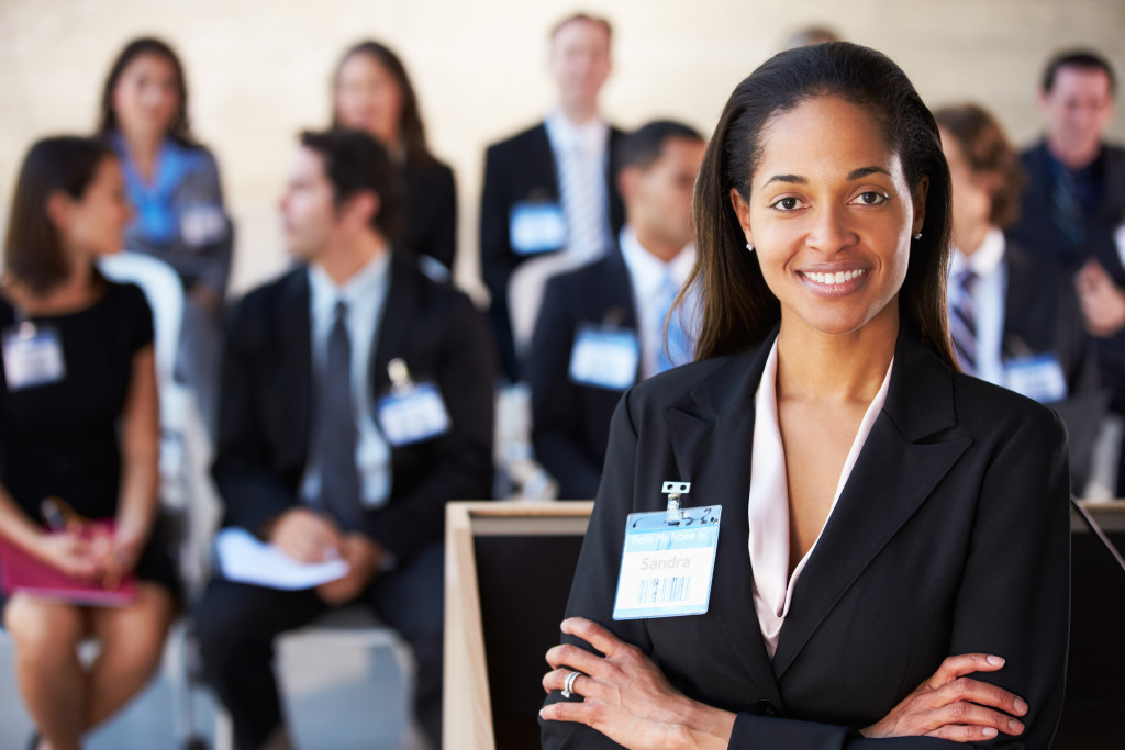 Businesswoman Delivering Presentation At Conference